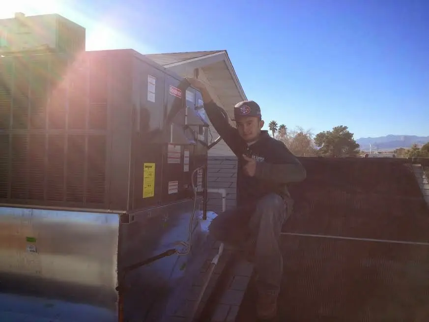 HVAC technician performing HVAC Inspection on a rooftop unit in Las Vegas